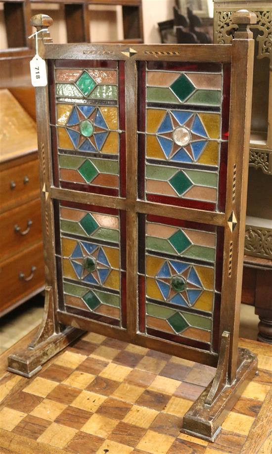 An Arts & Crafts stained glass inset table screen and a games table, W.41cm and W.69cm